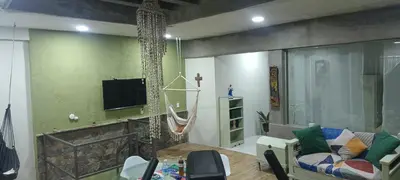 Una televisión o centro de entretenimiento en Departamento tipo Loft