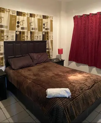 Cama o camas de una habitación en Departamento con terraza lobo