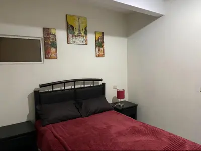 Cama o camas de una habitación en Departamento con terraza verde