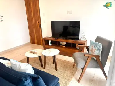 Una televisión o centro de entretenimiento en A Estrenar Alberca Vista al Río y Mar con AC