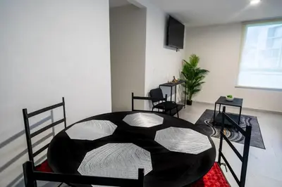 Una televisión o centro de entretenimiento en Depa Aria Puebla