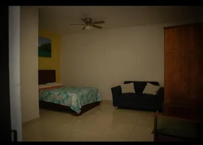 Cama o camas de una habitación en Casa con alberca