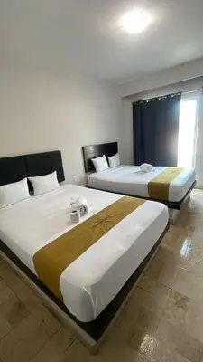 Cama o camas de una habitación en Hotel Sharidia Inn