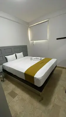 Cama o camas de una habitación en Hotel Sharidia Inn