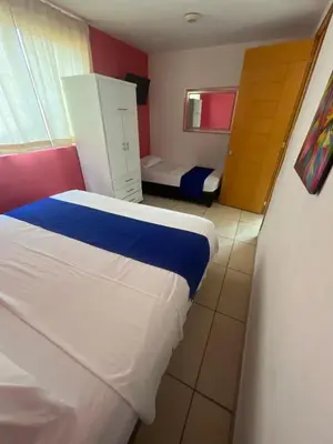 Cama o camas de una habitación en Tequesquitengo Finca Flor de Loto