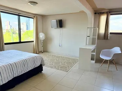 Cama o camas de una habitación en Departamento enteró en Mayorazgo