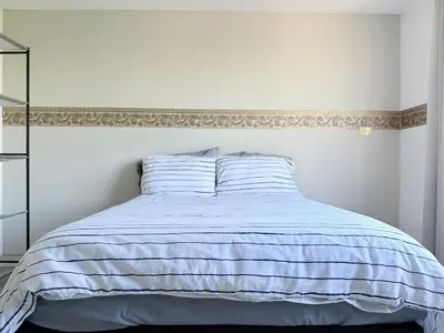 Cama o camas de una habitación en Departamento enteró en Mayorazgo