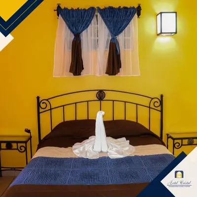 Cama o camas de una habitación en Hotel Cristal Chignahuapan