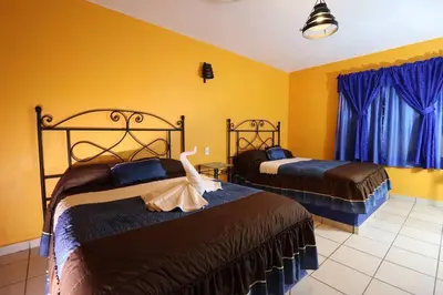 Cama o camas de una habitación en Hotel Cristal Chignahuapan