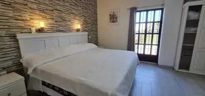 Cama o camas de una habitación en Hotel El Encuentro