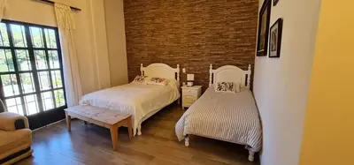 Cama o camas de una habitación en Hotel El Encuentro