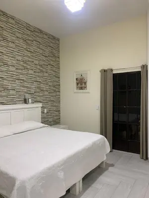 Cama o camas de una habitación en Hotel El Encuentro