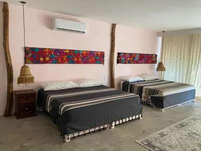 Cama o camas de una habitación en Cabañas y Restaurante La Luna