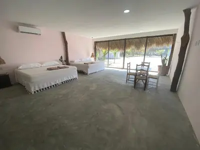 Cama o camas de una habitación en Cabañas y Restaurante La Luna