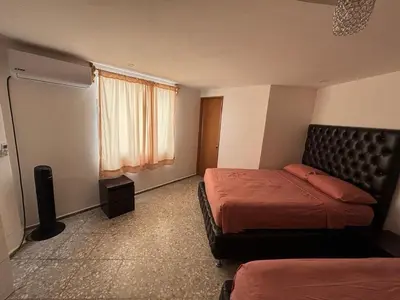 Cama o camas de una habitación en PH vista a la bahía