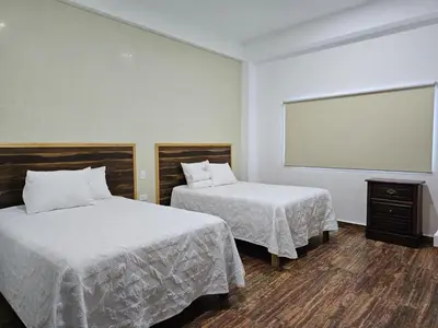 Cama o camas de una habitación en Hotel Familiar Abejac