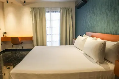 Cama o camas de una habitación en Mandarina's House Hotel