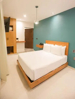 Cama o camas de una habitación en Mandarina's House Hotel