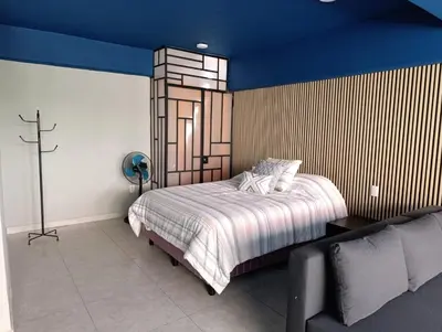 Cama o camas de una habitación en El Árbol Plaza Suites - Agua