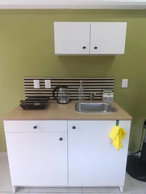 Una cocina o zona de cocina en El Árbol Plaza Suites - Terra