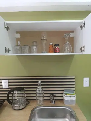 Una cocina o zona de cocina en El Árbol Plaza Suites - Terra