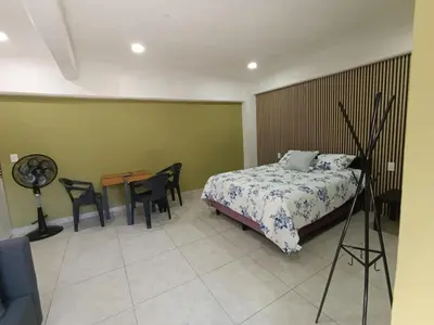 Cama o camas de una habitación en El Árbol Plaza Suites - Terra