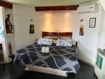 Cama o camas de una habitación en Hotel Las Flores