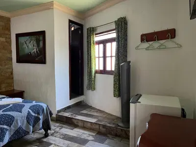 Cama o camas de una habitación en Hotel Las Flores