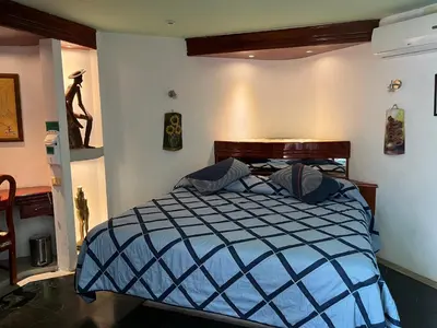 Cama o camas de una habitación en Hotel Las Flores