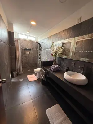Un baño de Suites vergel planta baja