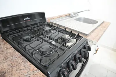 Una cocina o zona de cocina en Departamentos La Soledad
