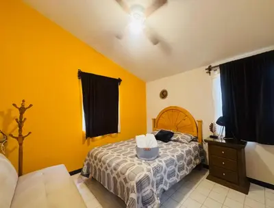 Cama o camas de una habitación en Casa Orquídeas Oaxaca