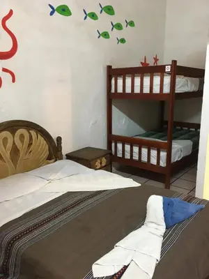 Cama o camas de una habitación en Hostal Luz de Luna Nuyoo