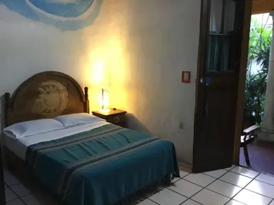 Cama o camas de una habitación en Hostal Luz de Luna Nuyoo