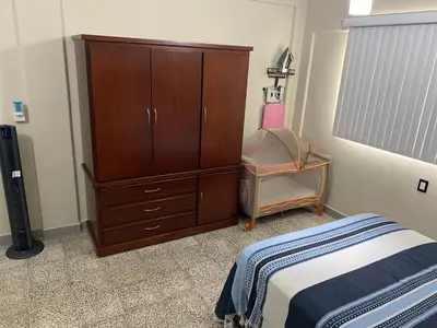 Cama o camas de una habitación en Departamento Runa, amplio, bonito y acogedor, completo de 2 recámaras y 3 camas matrimoniales