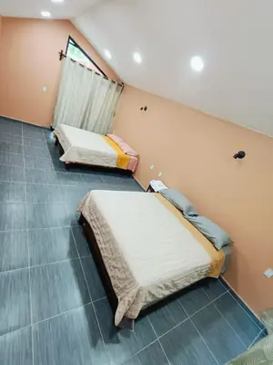 Cama o camas de una habitación en Cabañas El Amanecer de AYUTA