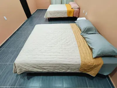 Cama o camas de una habitación en Cabañas El Amanecer de AYUTA
