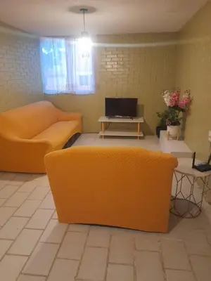 Una televisión o centro de entretenimiento en Departamento Mamá Rosita