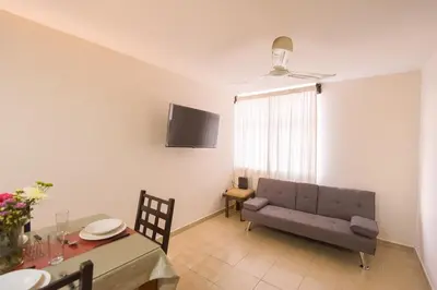 Una televisión o centro de entretenimiento en Casa Dorada