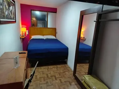 Cama o camas de una habitación en Posada Familiar Lupita