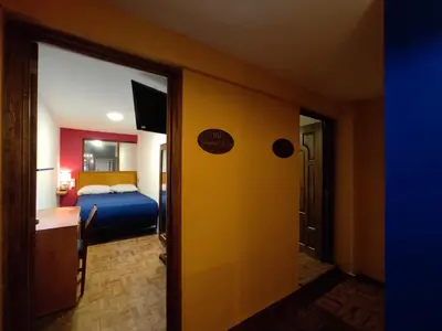Cama o camas de una habitación en Posada Familiar Lupita
