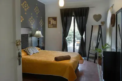 Cama o camas de una habitación en Casa cerca del centro histórico María Luisa