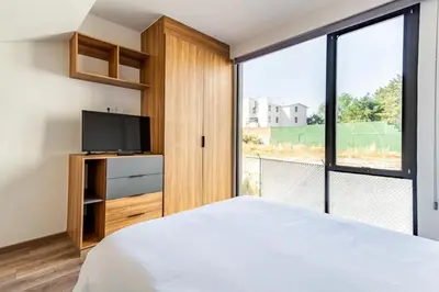 Cama o camas de una habitación en Moderno Loft Totalmente Equipado