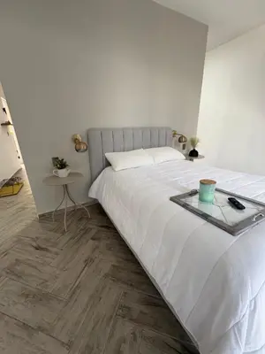 Cama o camas de una habitación en Loft ËNXË Boutique Habitación Gray
