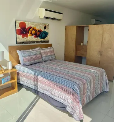 Cama o camas de una habitación en Increíbles condominios con vista al mar