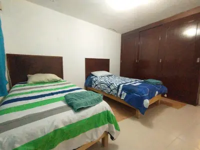 Cama o camas de una habitación en Amplia casa ideal para grupos grandes en cholula