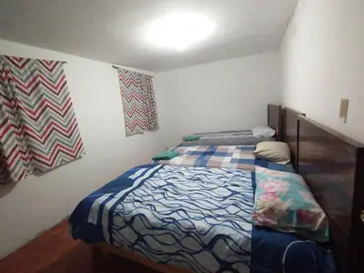 Cama o camas de una habitación en Amplia casa ideal para grupos grandes en cholula