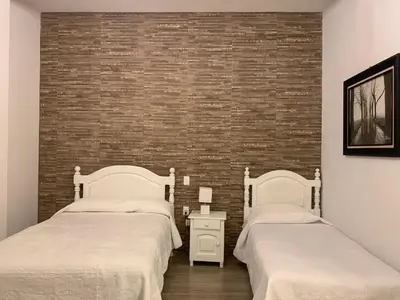 Cama o camas de una habitación en Hotel Y Villas el Encuentro