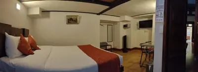 Cama o camas de una habitación en Aroma Hotel