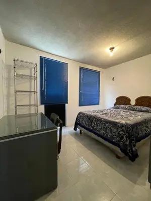 Cama o camas de una habitación en Amplia casa para huéspedes
